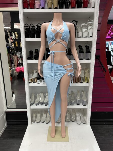 Light blue two-piece wrap outfit with crisscross halter top and high slit skirt