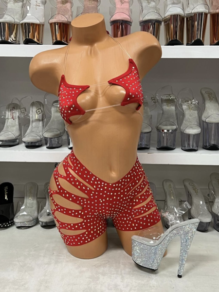 Red star print short set with cutout details on mannequin