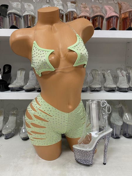 Light green star print short set with cutout details on mannequin