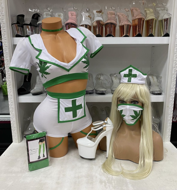 White nurse costume with green leaf accents and medical cross details