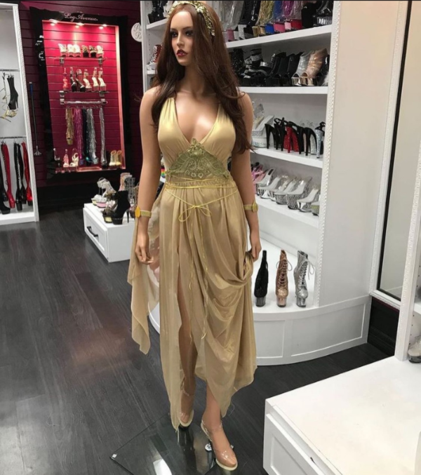 Gold mesh romper with lace applique, waist ties, attached skirt drapes, and glitter leaf headpiece
