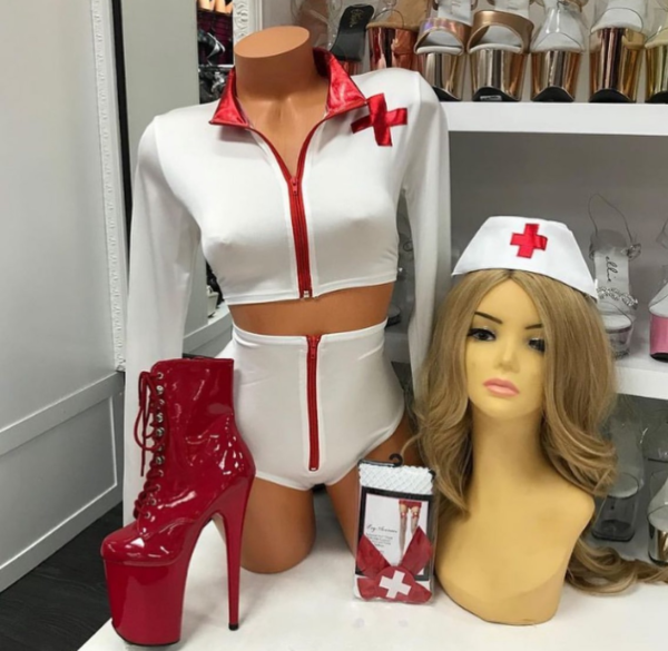 White nurse costume with red trim featuring crop top and high-waisted shorts
