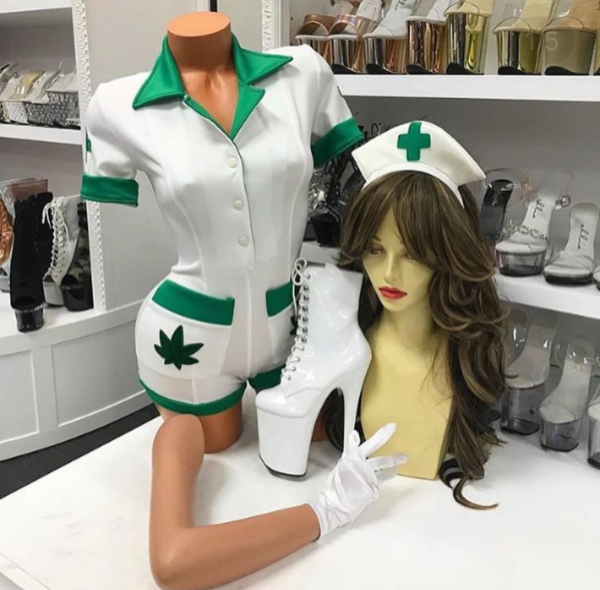 White and green herbal nurse romper costume with leaf patches and medical cap