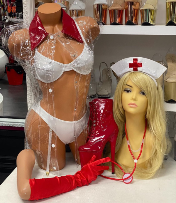 White lingerie nurse costume with clear PVC coat, red accents, and medical accessories