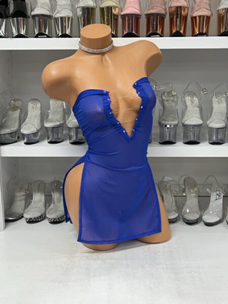 Royal blue mesh mini dress with lace-up front and rhinestone trim on mannequin with sheer fabric and side slits