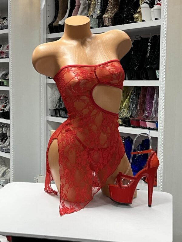 Red lace mesh cutout dress with strapless top and high slits on display mannequin