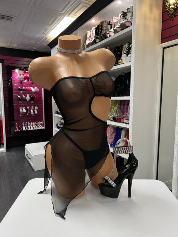 Black sheer mesh cutout dress on mannequin with high slits and strapless fit