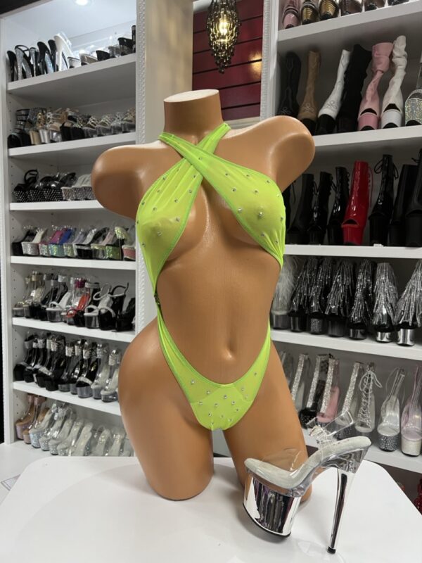 Lime rhinestone dancewear slingshot bodysuit with criss-cross halter neckline on mannequin