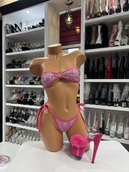 Pink rhinestone bandeau bikini set with side-tie bottoms on mannequin paired with pink fluffy heels