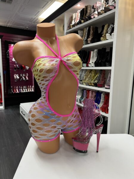 Rainbow cutout romper with holographic fabric, rhinestones, and hot pink trim displayed on a mannequin