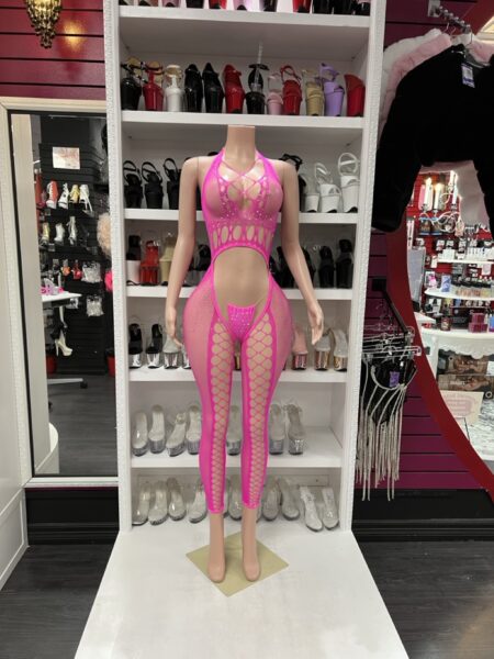 Mannequin wearing neon pink cutout fishnet bodystocking with halter neckline and circular cutout details
