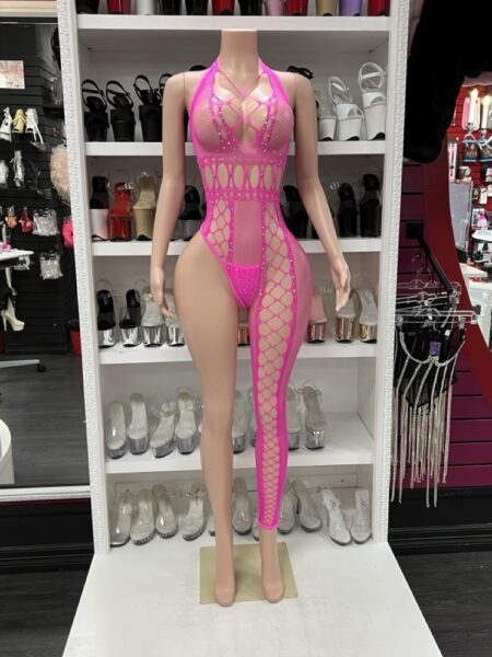 Mannequin wearing neon pink asymmetrical one-legged fishnet cutout bodystocking with halter neckline