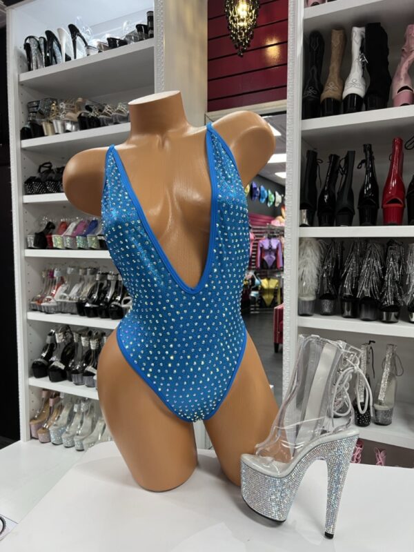 blue rhinestone bodysuit with deep-V neckline on mannequin and silver platform heels