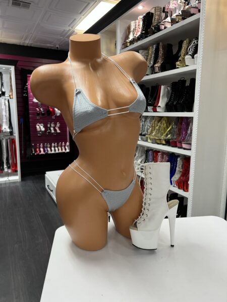 gray micro bikini on mannequin with white lace-up platform boots