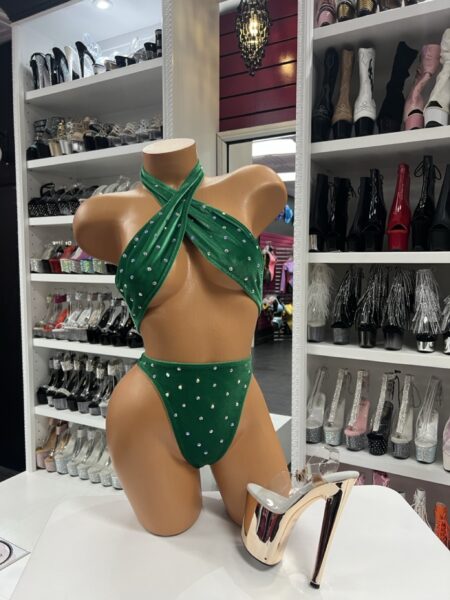 green rhinestone bodysuit on mannequin with gold platform heels