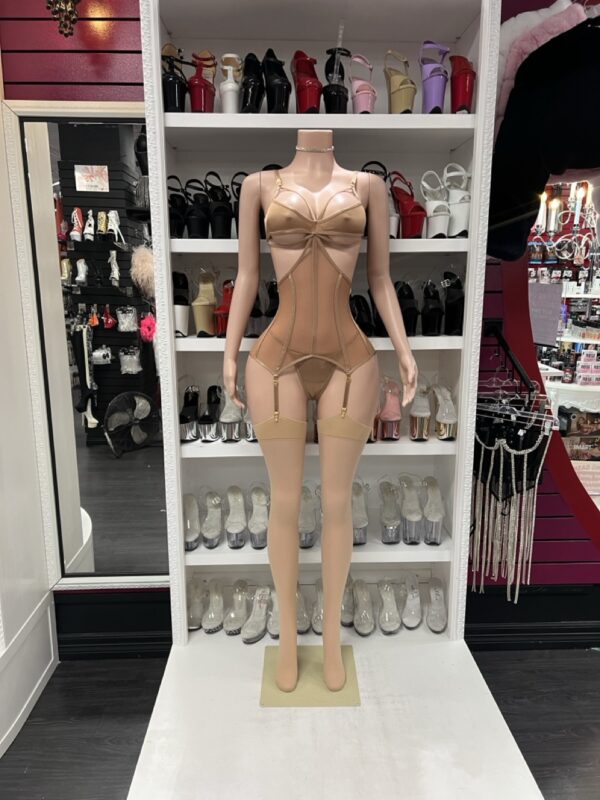 nude corset lingerie set with mesh and garters on mannequin, stockings not included