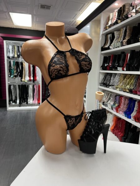 black lace micro bikini with triangle top and thong on mannequin with black lace-up heels