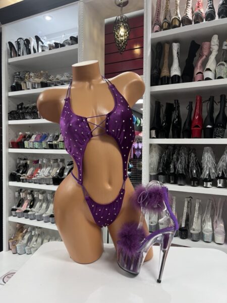 Purple rhinestone bodysuit with cutout details and sparkle embellishments