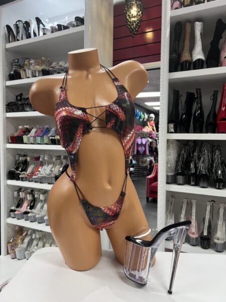 Black and red patterned romper with lace-up front and cutout details