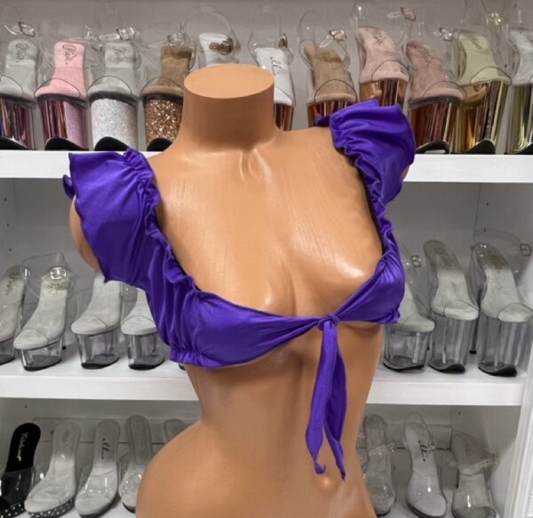 Vibrant purple ruffle tie front crop top on mannequin display