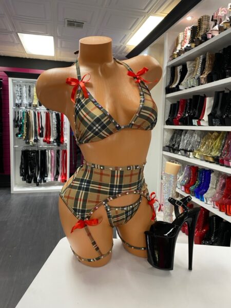 Plaid lingerie garter set with rhinestone trim and red bow accents