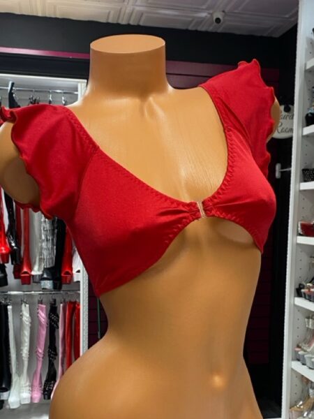 Red Flutter Sleeve Crop Top is your go-to piece when you want a mix of playful flirtation and bold confidence. Designed with a vibrant scarlet hue and ruffled flutter sleeves, this crop top creates an eye-catching silhouette that transitions easily from the stage to a night out. Whether you’re pairing it with a rhinestone skirt, a bikini bottom, or sleek leather pants, this versatile top brings attention where it counts. Designed for Impact The bold red tone is more than just a color—it’s a statement. The flattering cropped cut draws focus to your waistline, while the flutter sleeves add movement and charm. This makes it perfect for performances, festivals, or even casual wear with a daring twist. Comfort Meets Style Crafted from a soft, stretchable material, the top hugs the body without feeling restrictive. The deep neckline creates a dramatic effect while the center ring detail ties the entire look together. You’ll love how this piece blends comfort with allure, keeping you confident in every setting. Why You’ll Love It Bold red shade that instantly grabs attention Flirty flutter sleeves for a feminine edge Cropped design that pairs with skirts, shorts, or dancewear bottoms Stretchy fabric for maximum comfort and mobility Eye-catching ring detail for a polished finish Styling Inspiration Pair the Red Flutter Sleeve Crop Top with our Pink Plunge Dress for a coordinated flirty collection, or mix it with a rhinestone mini skirt for a high-shine stage look. For additional outfit inspiration, check out Cosmopolitan’s fashion trend guide on statement tops that are making waves this season. With its flattering cut and fearless design, the Red Flutter Sleeve Crop Top is more than just clothing—it’s confidence stitched into fabric.