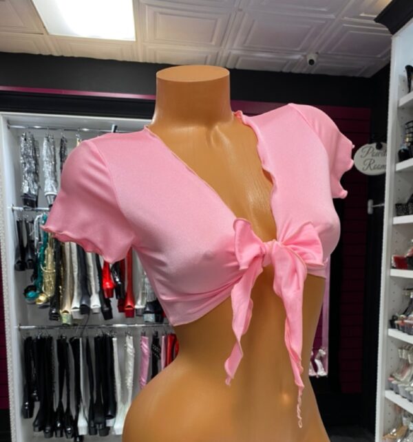 Baby pink tie front crop top with short sleeves and deep v-neck