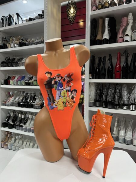 Orange anime print high-cut bodysuit on mannequin with matching platform boot
