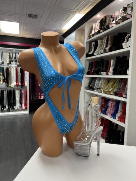 Turquoise rhinestone romper with plunging neckline and open back cutout design