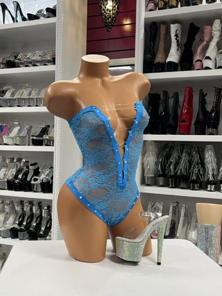 Turquoise lace strapless bodysuit with rhinestone details, floral lace fabric, and lace-up neckline for bold stagewear and nightlife fashion