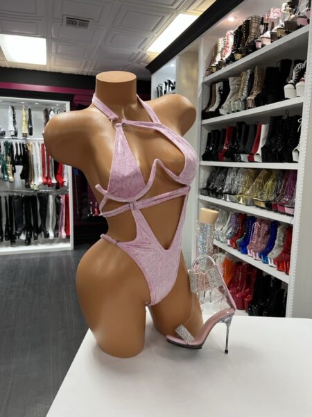 Pink velvet cutout bodysuit with halter neckline, triangle bust, and strappy cutouts for stagewear and nightlife fashion