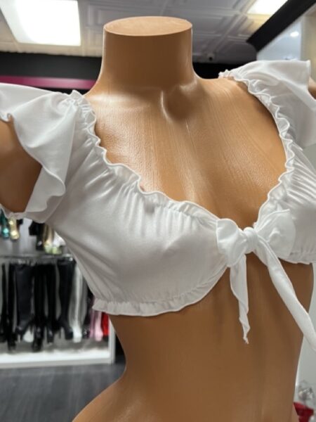 Crisp white ruffle tie front crop top on mannequin display