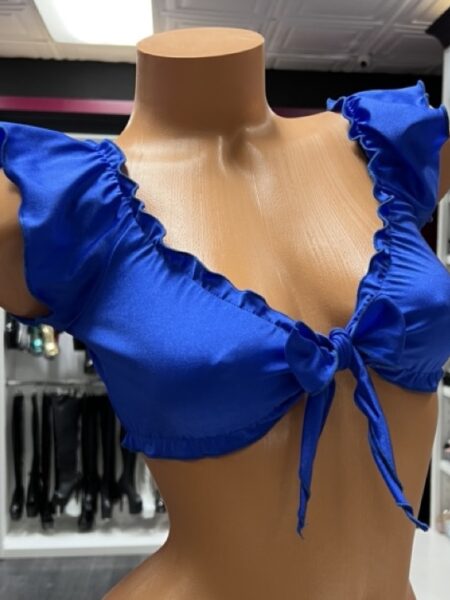 Bold royal blue ruffle tie front crop top on mannequin display