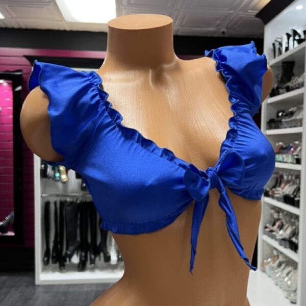 Bold royal blue ruffle tie front crop top on mannequin display