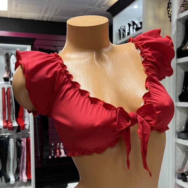 Bold red ruffle tie front crop top on mannequin display