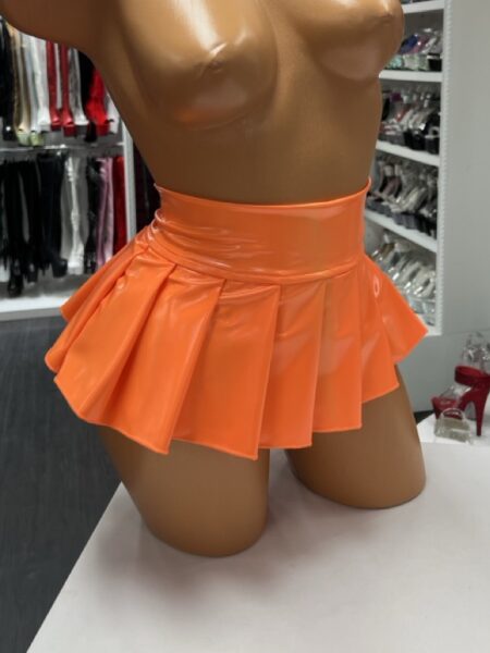 orange vinyl pleated skirt with high-shine finish