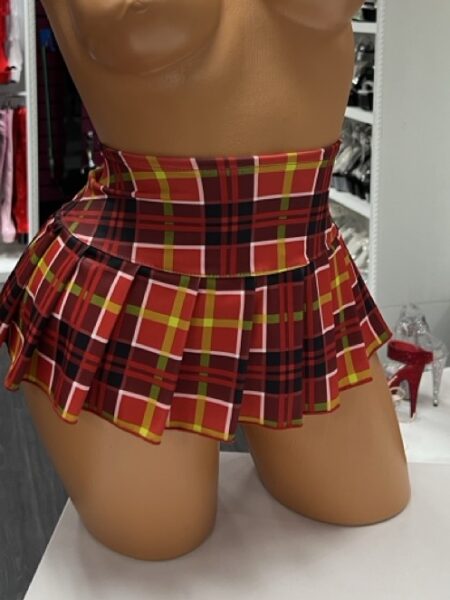 Red plaid schoolgirl mini skirt with pleated design on model