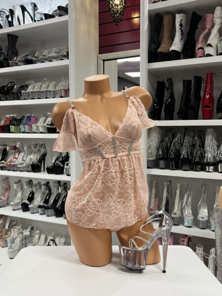 Blush pink lace lingerie dress on mannequin with clear platform heels