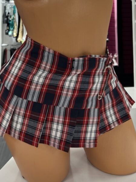 Red plaid pleated mini skirt with edgy safety pin detail