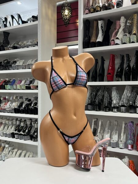 Image of pink plaid bikini set with black trim, adjustable top, and thong bottom styled with pink chrome platform heels.