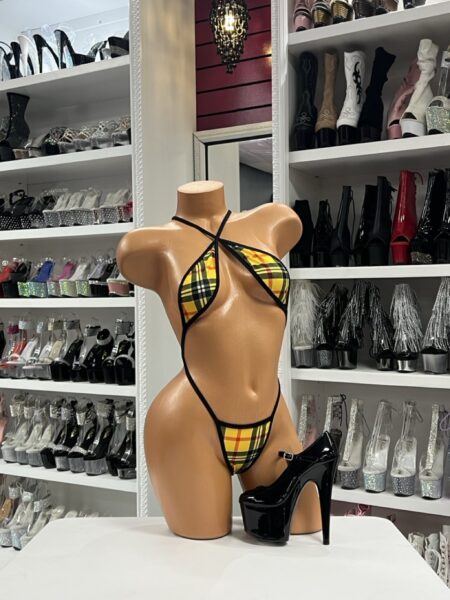 Yellow plaid crossed slingshot bikini on mannequin