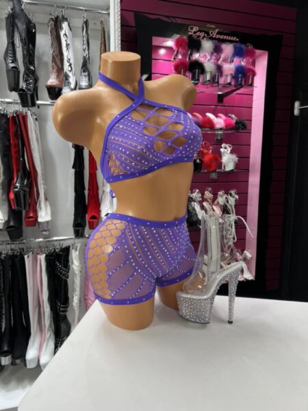 Woman in lavender fishnet short set with stretchy top and shorts for flexible movement