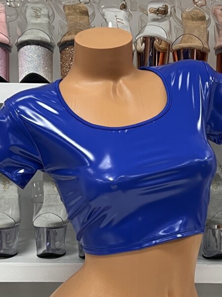 Royal blue vinyl crop top with short sleeves and scoop neck on model