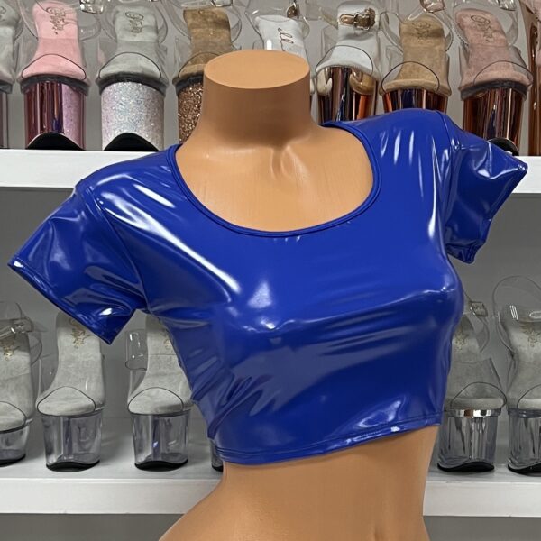 Royal blue vinyl crop top with short sleeves and scoop neck on model