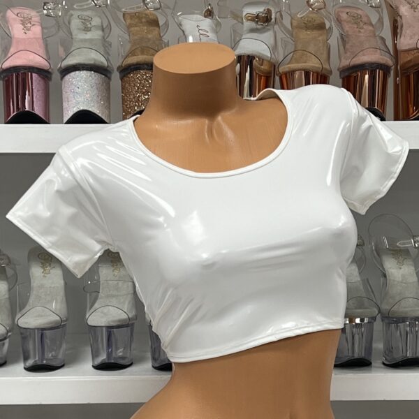 White vinyl crop top with short sleeves and scoop neck on model