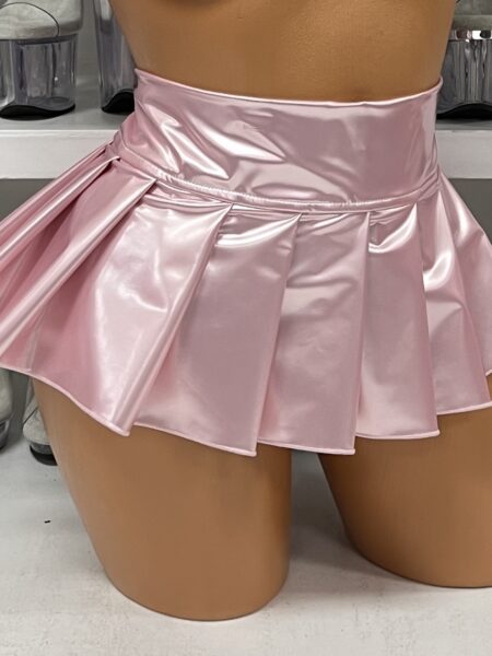 Baby pink pleated vinyl mini skirt with side zipper on display
