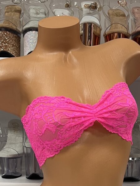 Vibrant hot pink lace bandeau crop top on mannequin display