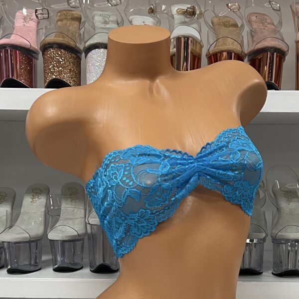 Stunning turquoise lace bandeau crop top on mannequin display