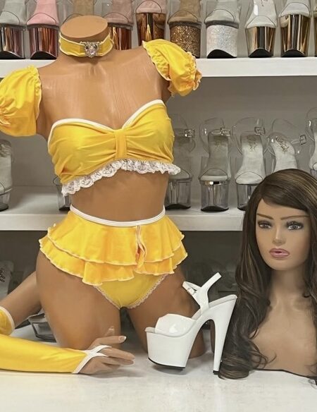 Yellow ruffle costume set with puff sleeve top, skirted bottom, gloves, and choker