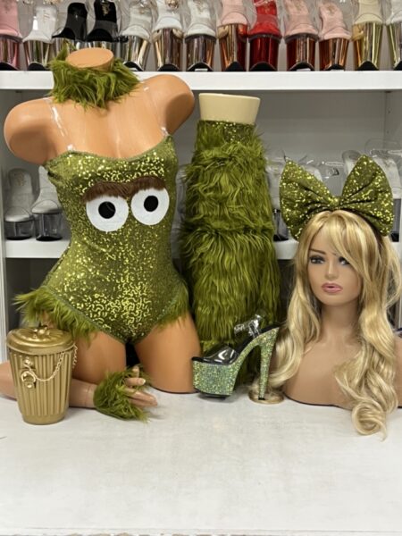Green sequined cranky creature costume with furry leg warmers and googly eyes